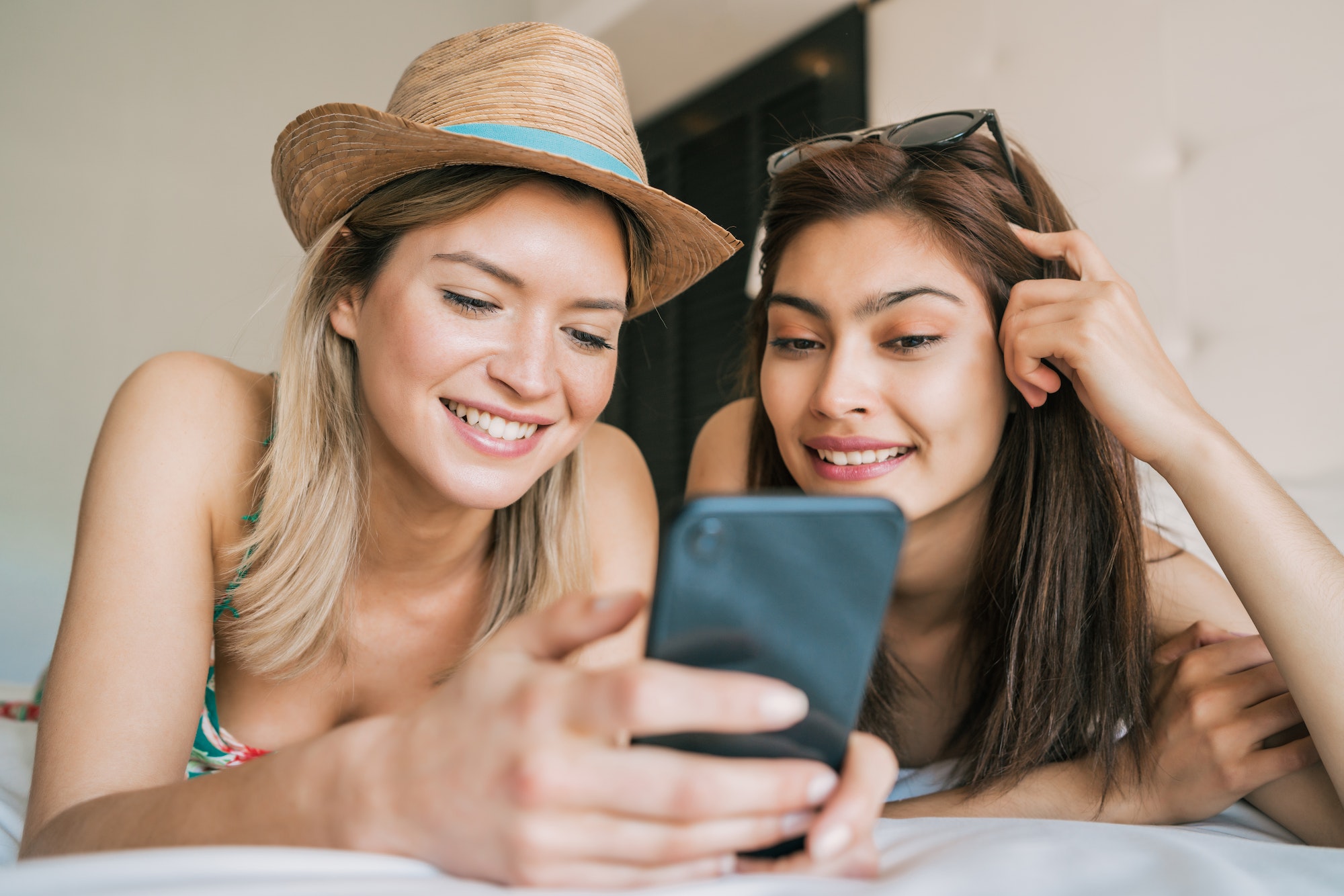 two-travelers-friends-relaxing-at-hotel-room-.jpg