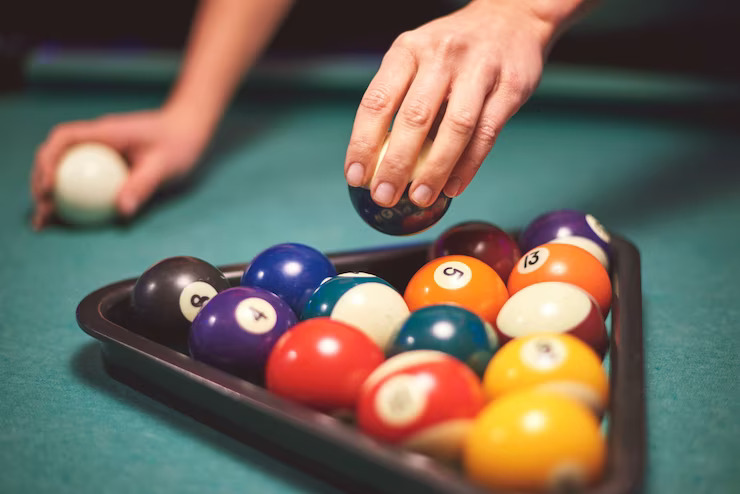 close-up-hand-aiming-play-pool-game_329181-15473